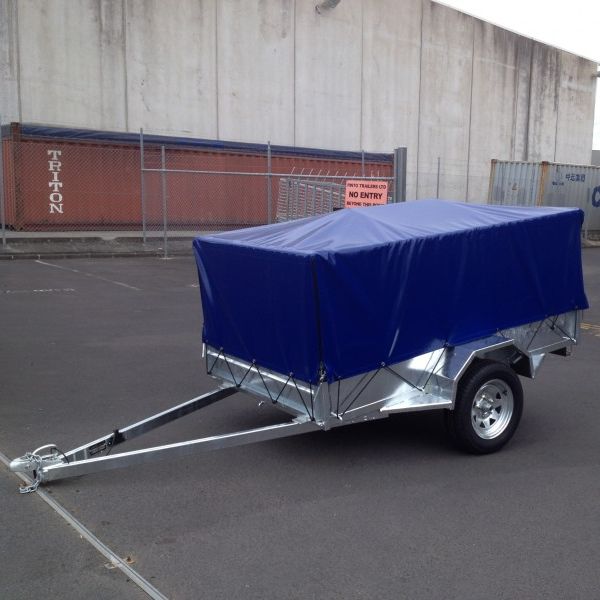 Blue cover shown on a 7x4 trailer with a 600mm cage.
