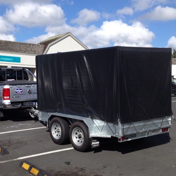 Black cover shown on an 8x5 tandem trailer with a 900mm cage
