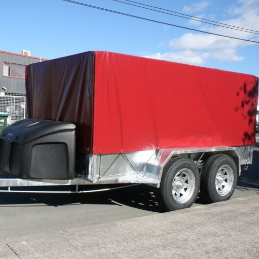 Maroon cover shown on a 9x5 braked tandem trailer with 900mm cage