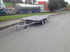 Braked tandem axle flat deck