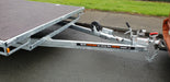 Braked tandem axle flat deck