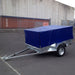  Blue cover shown on a 7x4 trailer with a 600mm cage.